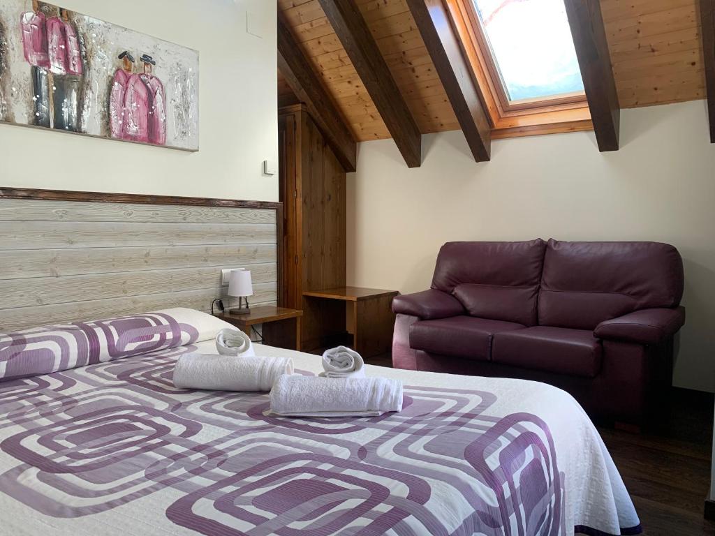 Postel nebo postele na pokoji v ubytování Casa Taconera