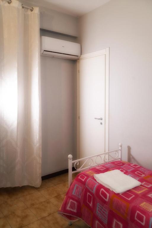 Postel nebo postele na pokoji v ubytování B&B Porta Roma
