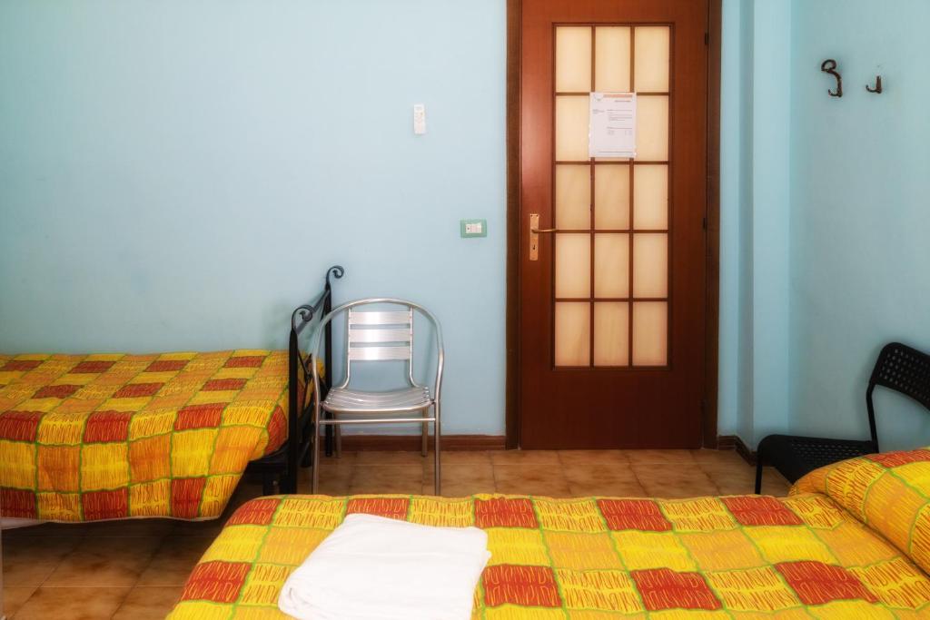 Postel nebo postele na pokoji v ubytování B&B Porta Roma