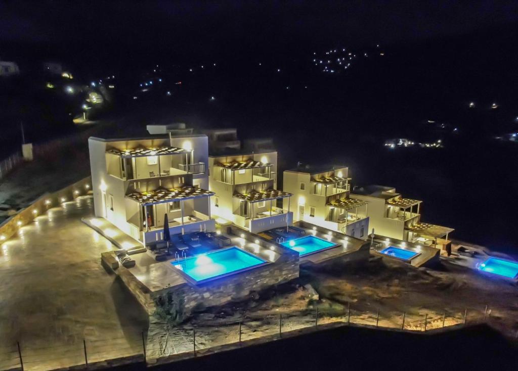 an aerial view of a building at night at Antigoni Villas in Gavrio