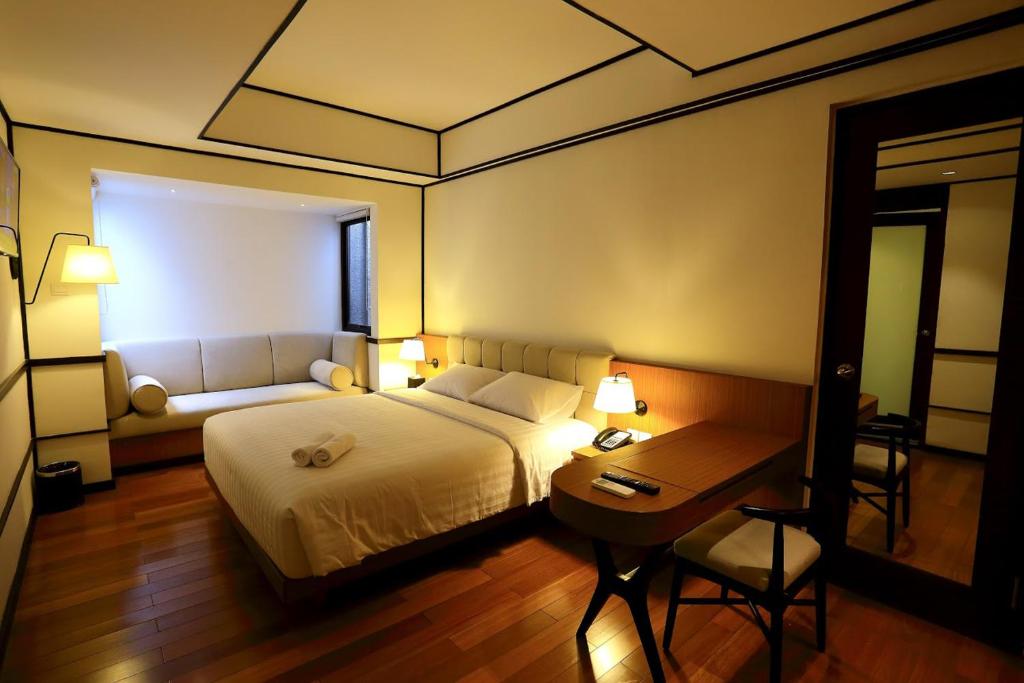 Postel nebo postele na pokoji v ubytování Namin Dago Hotel