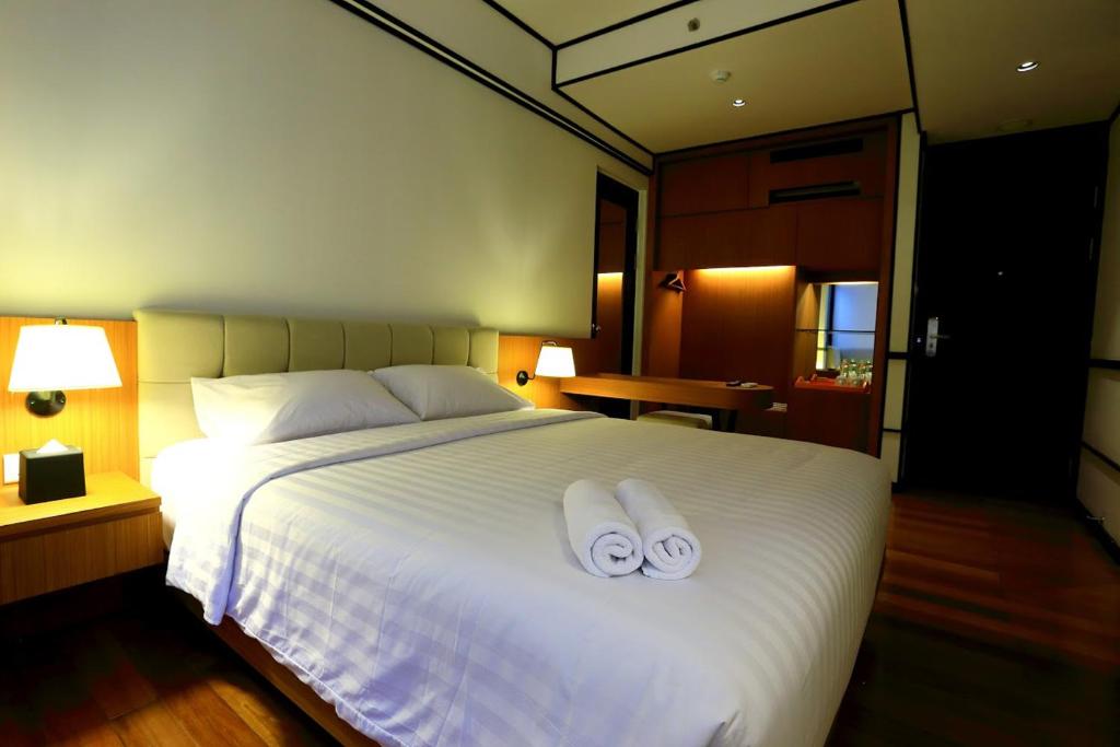Postel nebo postele na pokoji v ubytování Namin Dago Hotel