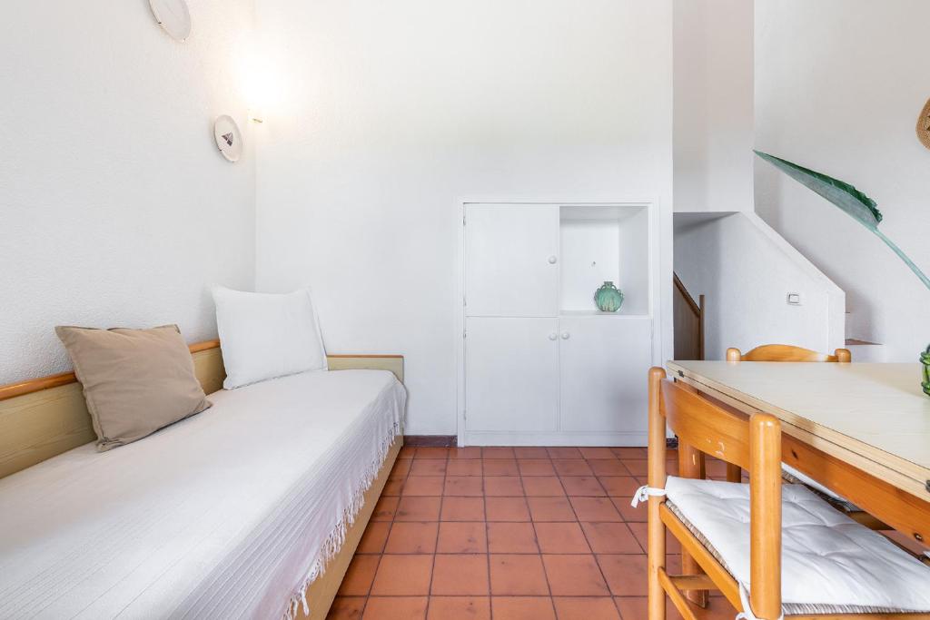 A bed or beds in a room at Domus Carlotta Apartment with sea view Villasimius