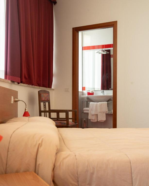 Postel nebo postele na pokoji v ubytování Hotel all'Oasi