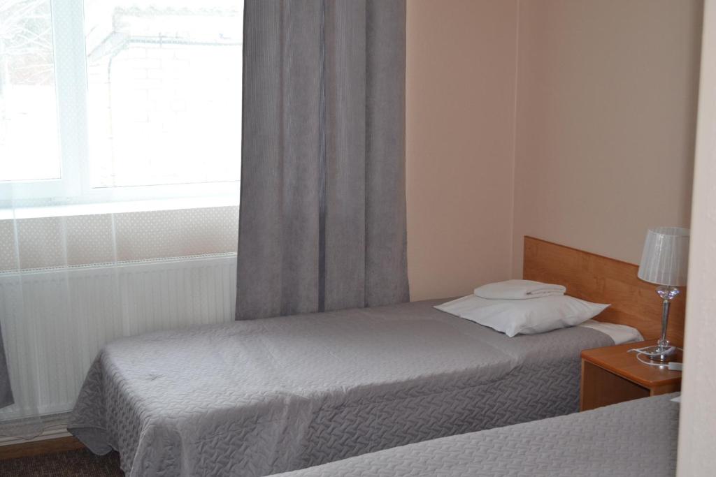 Postel nebo postele na pokoji v ubytování Hotel Yes