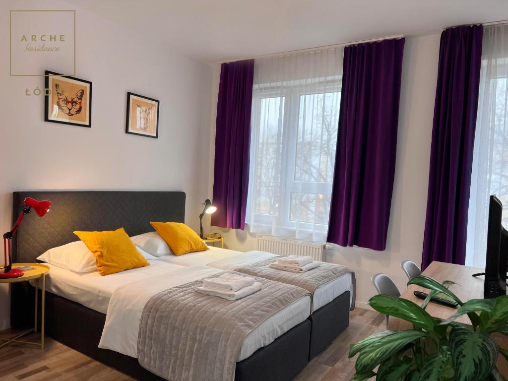 Postel nebo postele na pokoji v ubytování Arche Residence Łódź