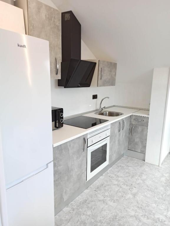 Kuchyň nebo kuchyňský kout v ubytování Apartamento Los olmos