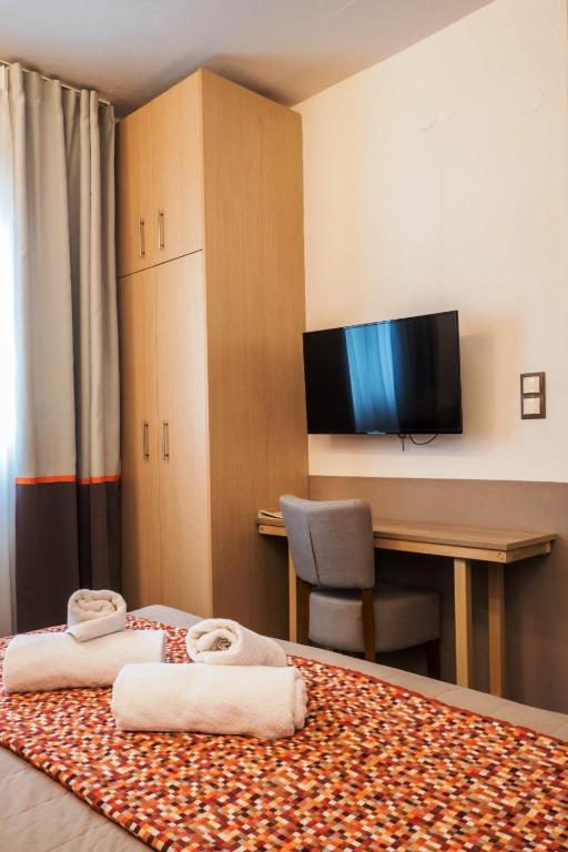 Postel nebo postele na pokoji v ubytování Asteris Village