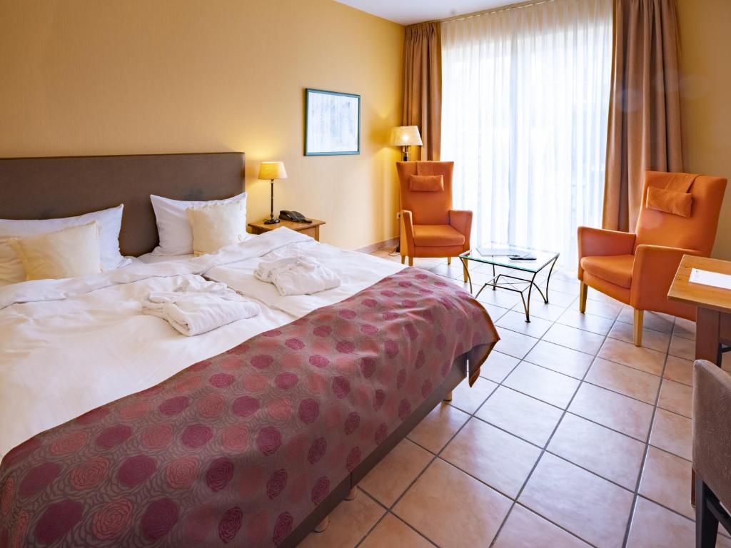 Postel nebo postele na pokoji v ubytování Hotel Hüttmann