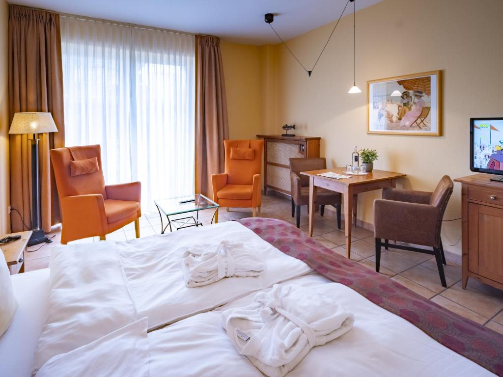 Postel nebo postele na pokoji v ubytování Hotel Hüttmann
