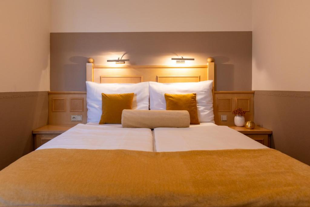 Postel nebo postele na pokoji v ubytování Hotel Abácie & Wellness