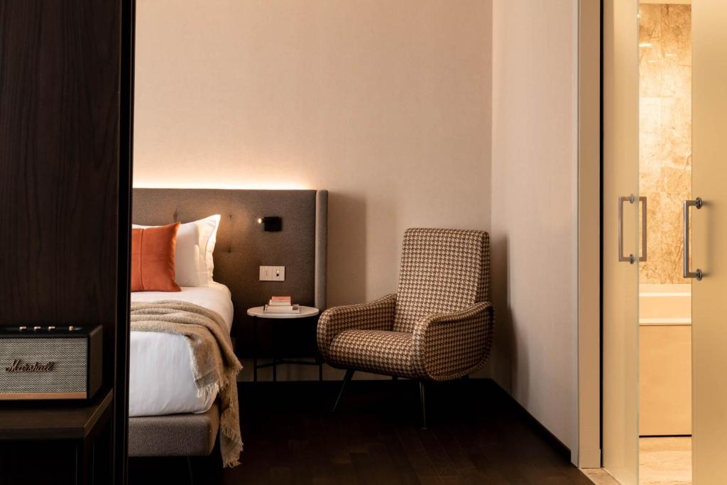 Postel nebo postele na pokoji v ubytování Litta Palace Milano