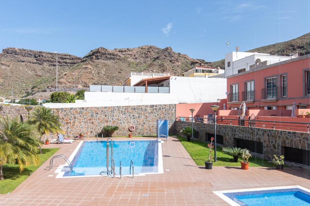 Bazén v ubytovaní Home2Book Comfy Apt Puerto Rico, Pool&Terrace alebo v jeho blízkosti