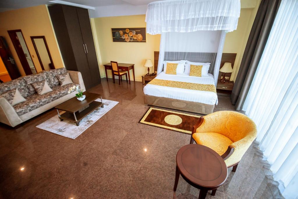 Postel nebo postele na pokoji v ubytování Koki Hotel