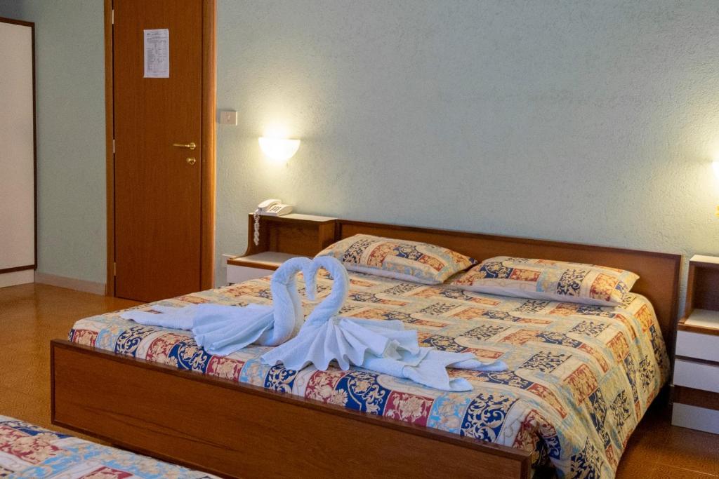 Postel nebo postele na pokoji v ubytování Albergo Ponte di Nava