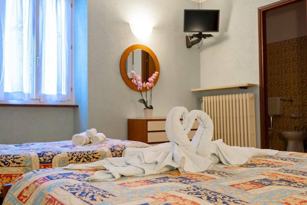 Postel nebo postele na pokoji v ubytování Albergo Ponte di Nava