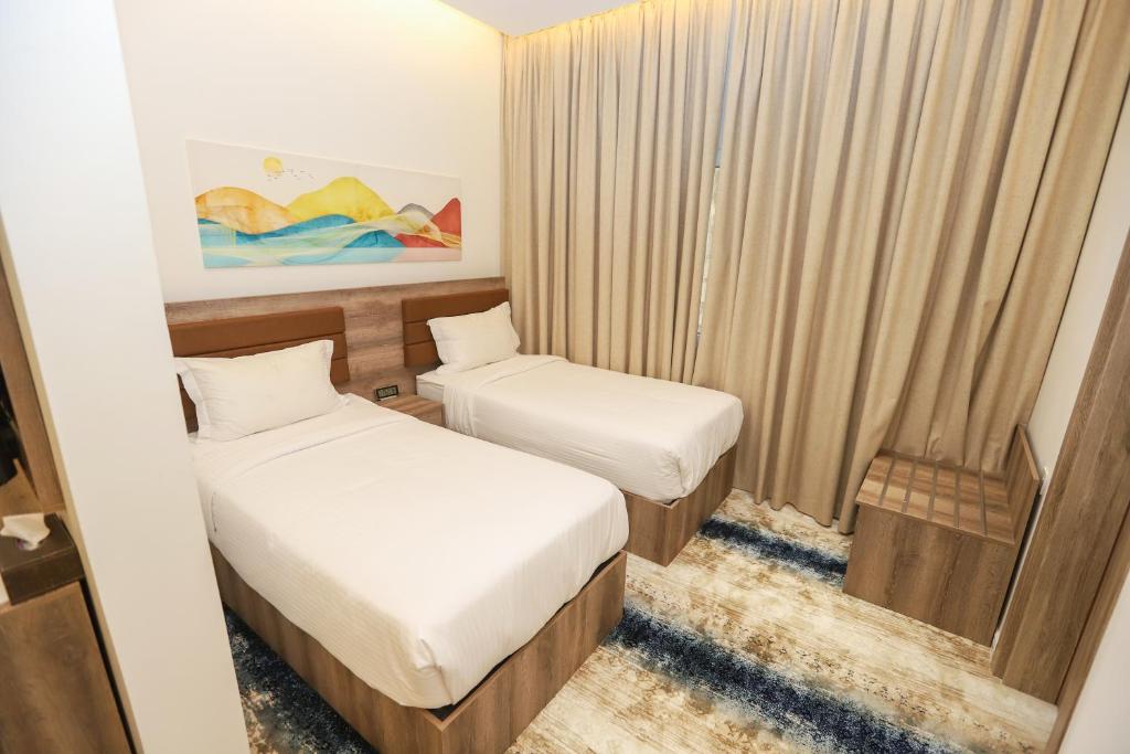 Postel nebo postele na pokoji v ubytování فندق المدينة القديمة Old Town Hotel