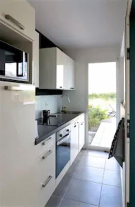 Kuchyň nebo kuchyňský kout v ubytování Villa Jalna Zamana 2 chambres piscine privée jardin