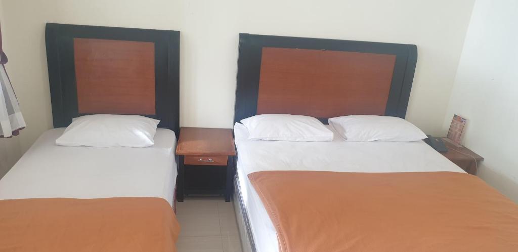 Postel nebo postele na pokoji v ubytování HOTEL CIPUNAGA