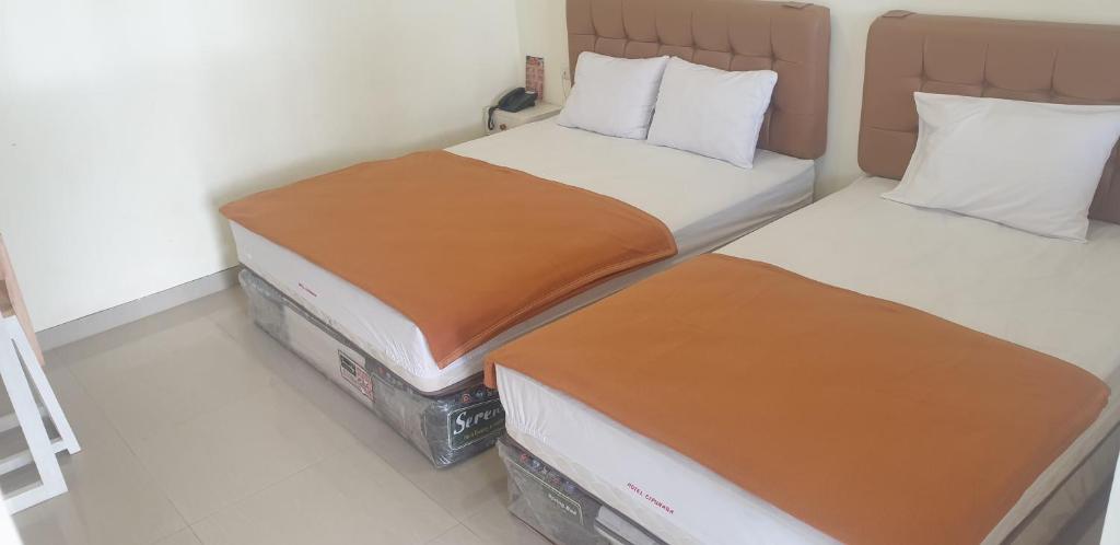 Postel nebo postele na pokoji v ubytování HOTEL CIPUNAGA