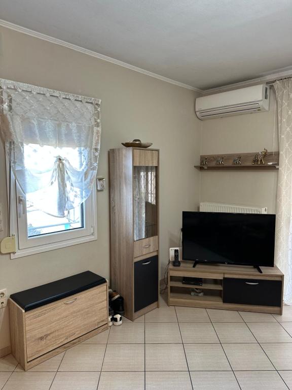 Telewizja i/lub zestaw kina domowego w obiekcie Rania House