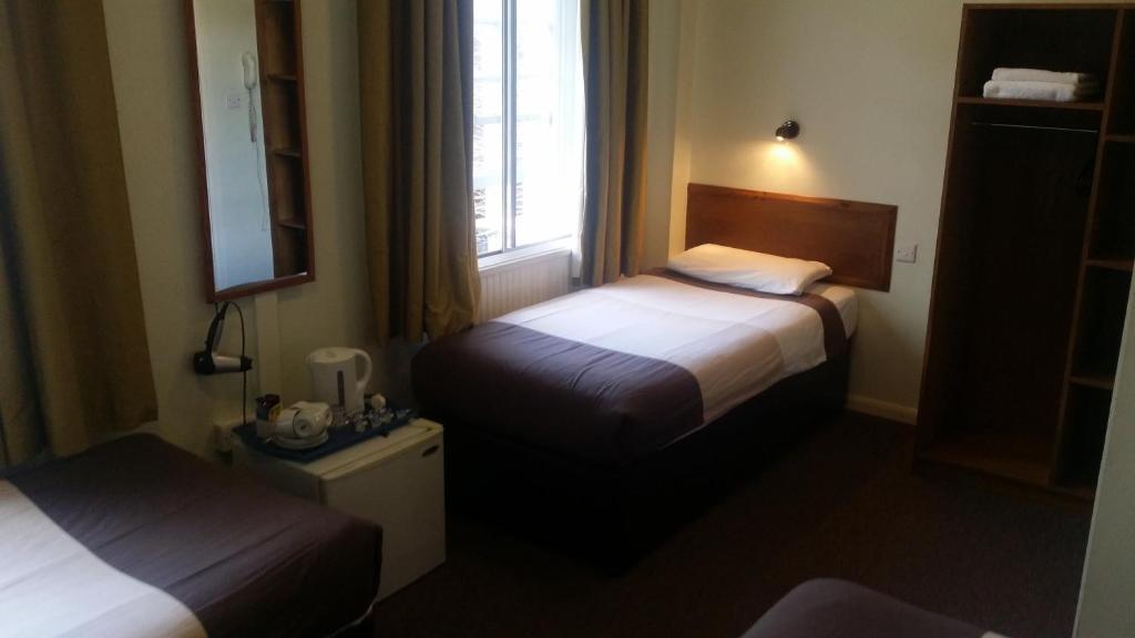 Postel nebo postele na pokoji v ubytování Arriva Hotel