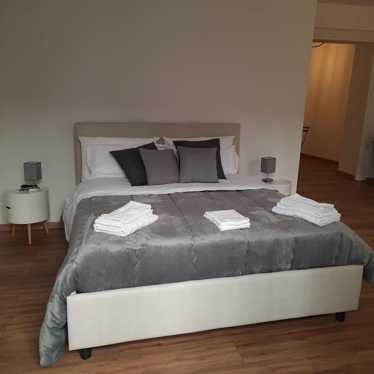 Łóżko lub łóżka w pokoju w obiekcie Quattrocantiapartments