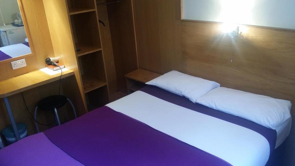 Postel nebo postele na pokoji v ubytování Arriva Hotel