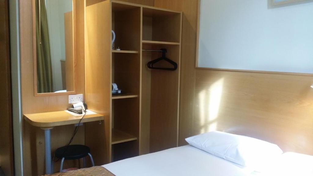 Postel nebo postele na pokoji v ubytování Arriva Hotel