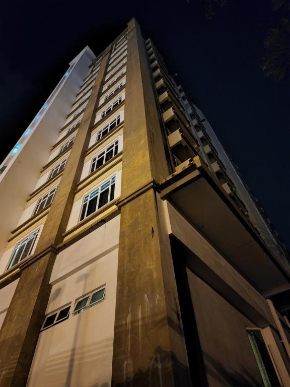 a tall building with its doors open at night at The Viana Apartment 1 in Kota Bharu