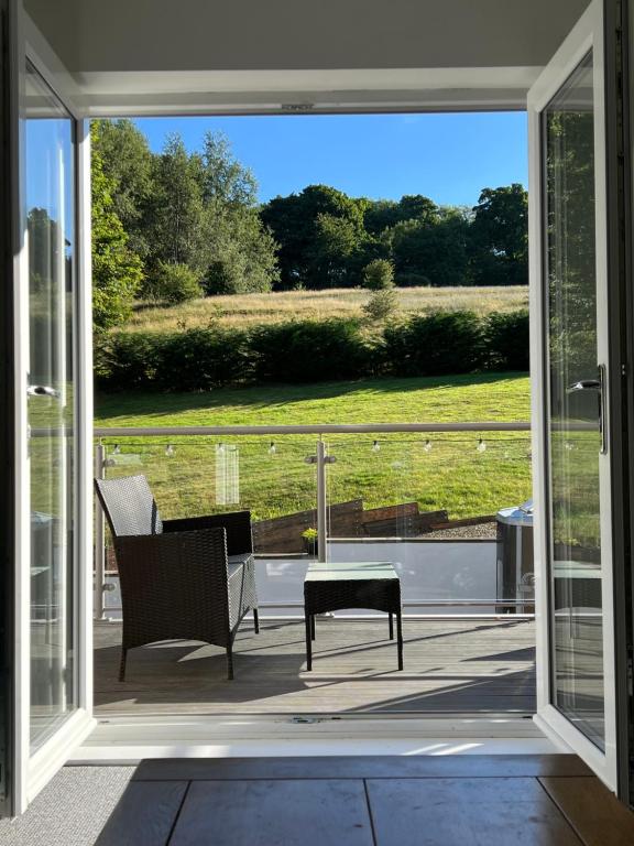 a sliding glass door to a patio with a table and chairs at Town House D in Dunston