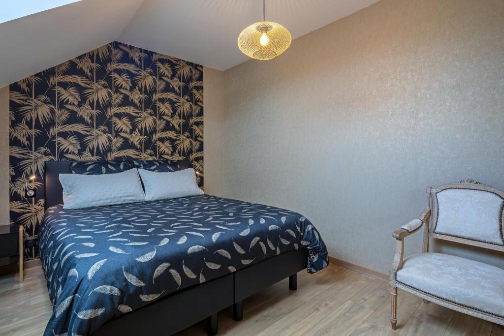 Postel nebo postele na pokoji v ubytování Gîte Serenida