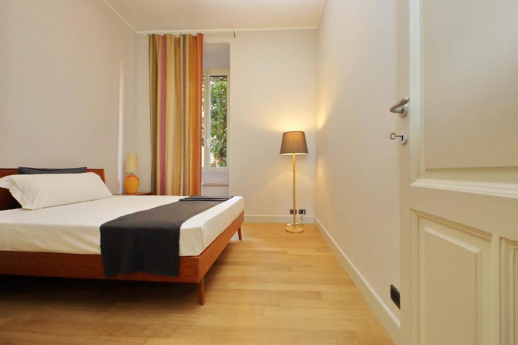 A bed or beds in a room at Boutique Apartment with view on Maxxi museum