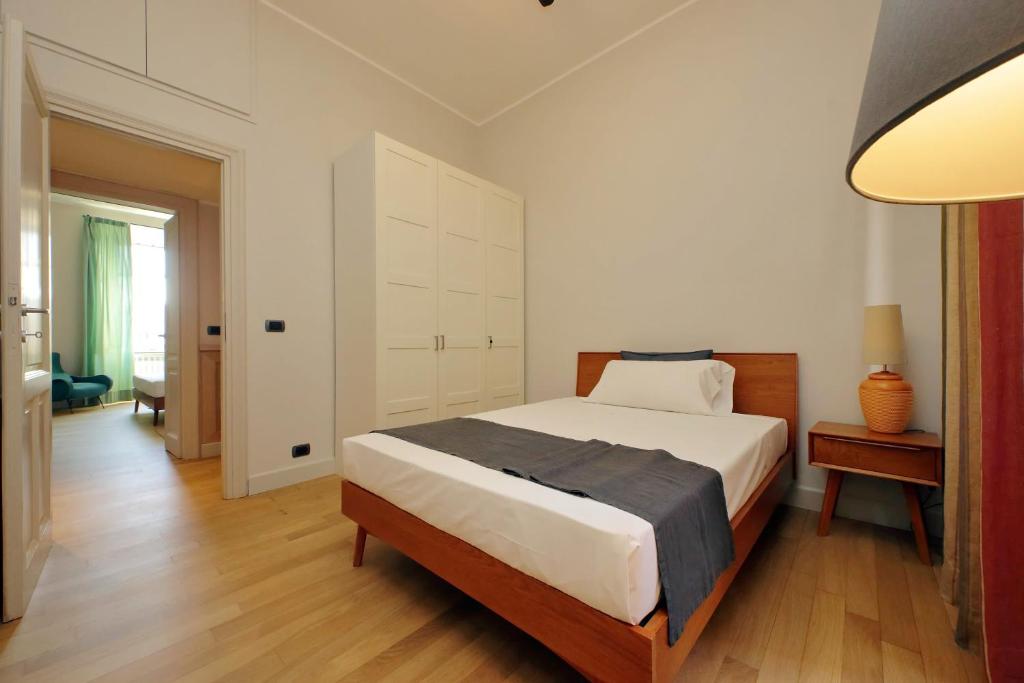 A bed or beds in a room at Boutique Apartment with view on Maxxi museum