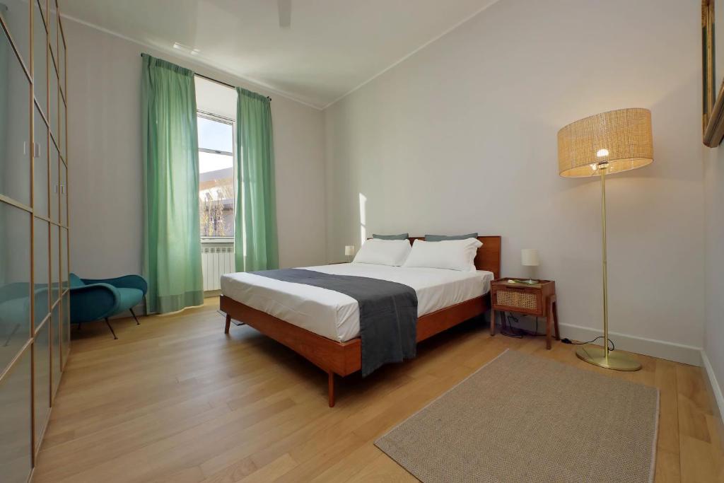 A bed or beds in a room at Boutique Apartment with view on Maxxi museum
