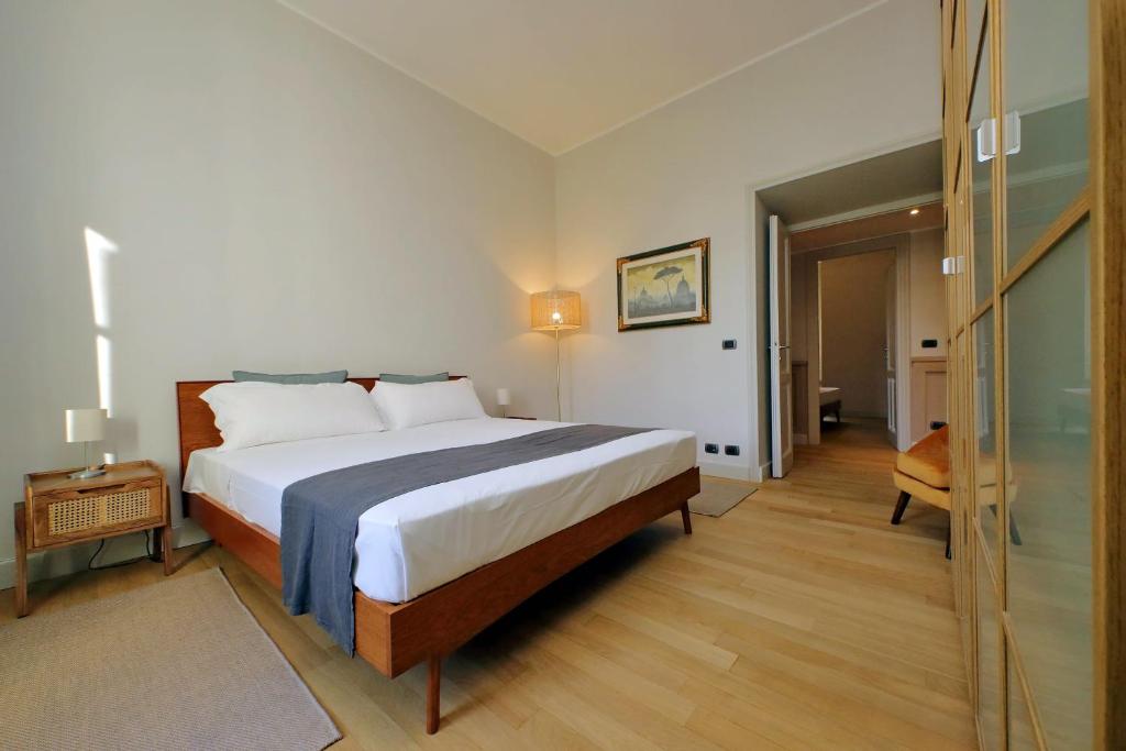 A bed or beds in a room at Boutique Apartment with view on Maxxi museum