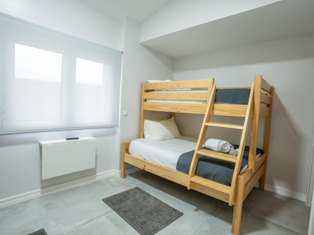 Postel nebo postele na pokoji v ubytování Quinta Lourena - Casa do Caseiro