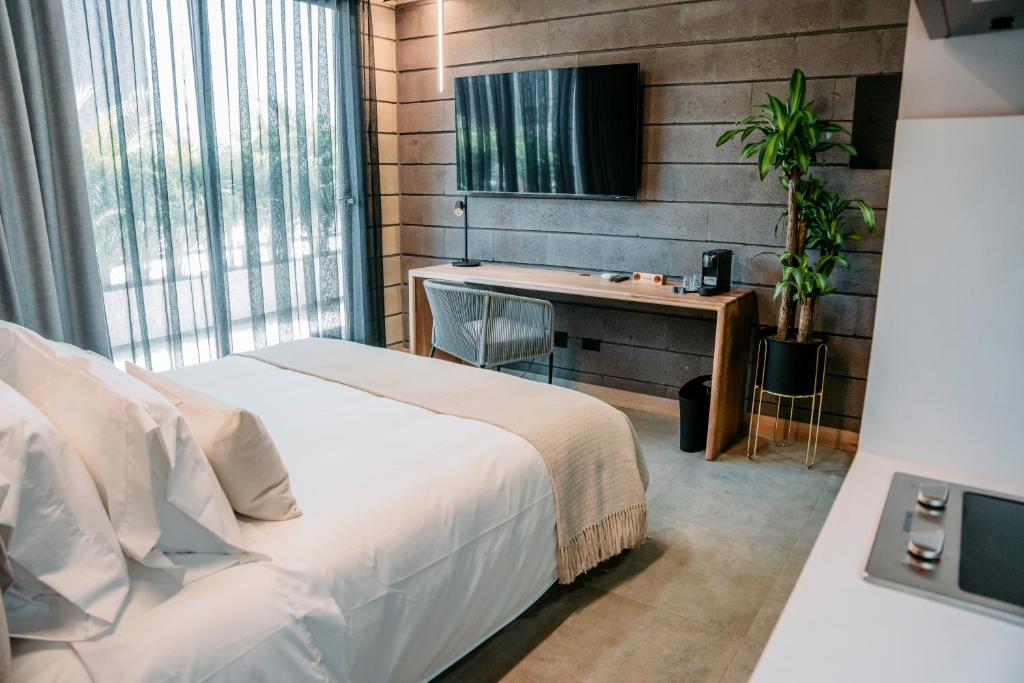 Postel nebo postele na pokoji v ubytování Hotel Living by Armoniko