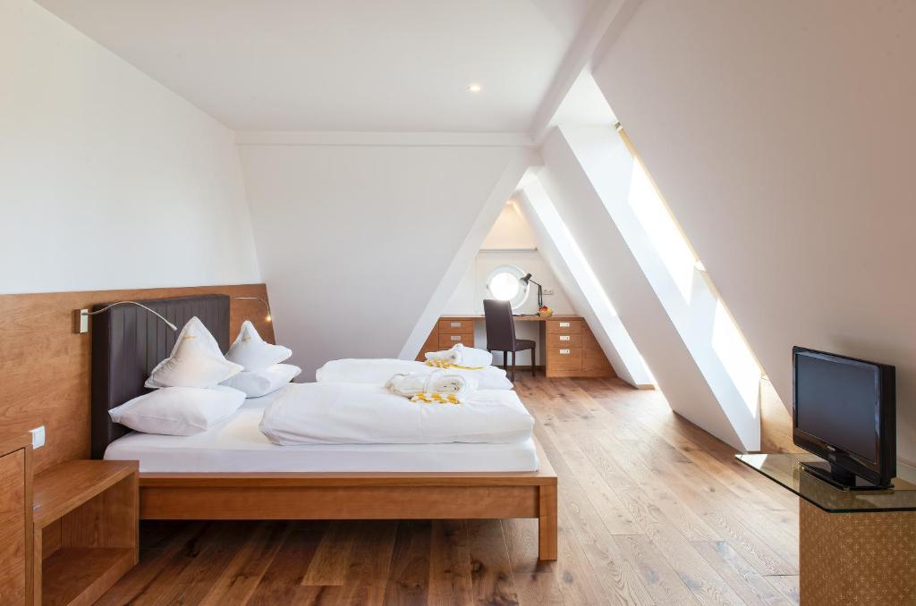 Postel nebo postele na pokoji v ubytování Hotel Sonnenhof