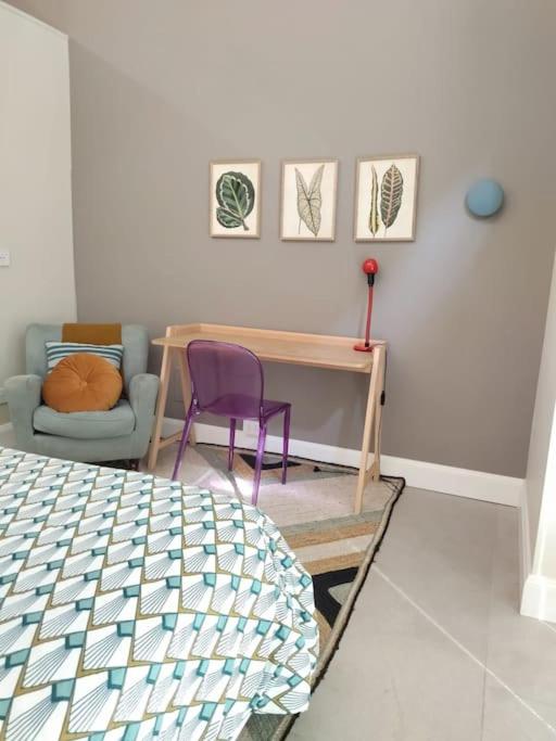 A bed or beds in a room at La vetrina sulla città