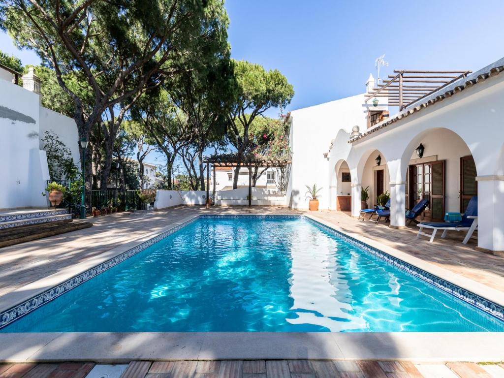 a swimming pool in the backyard of a house at Akisol Faro Relax in Faro