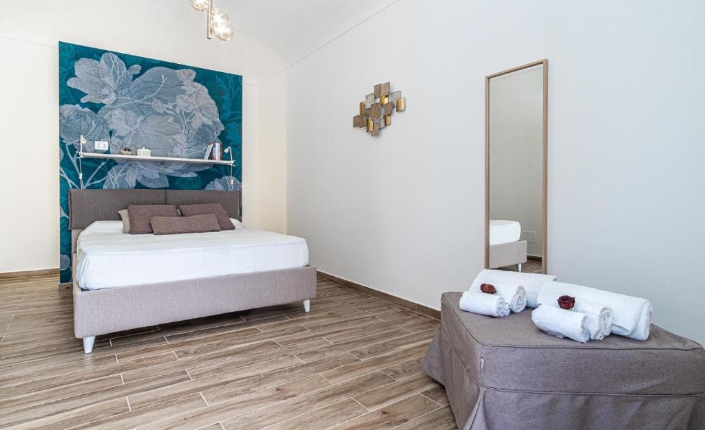 Posteľ alebo postele v izbe v ubytovaní FLOWER SUITE B&B