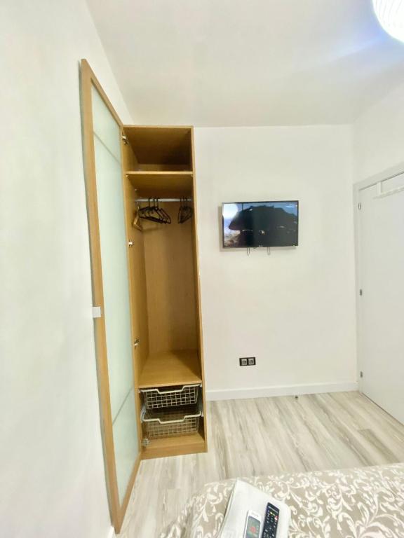 A bed or beds in a room at Piramides 1 Apartment