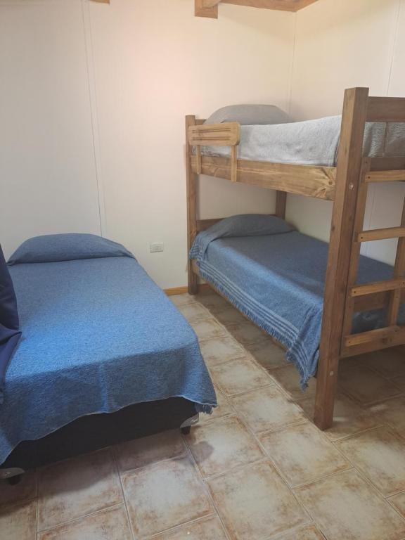 Postel nebo postele na pokoji v ubytování NEUQUEN alojamiento