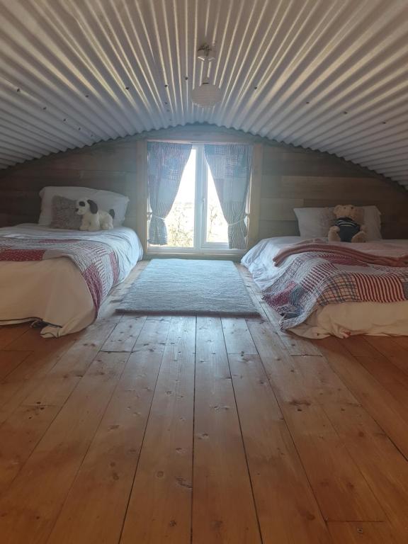 Postel nebo postele na pokoji v ubytování Sallys Cabin