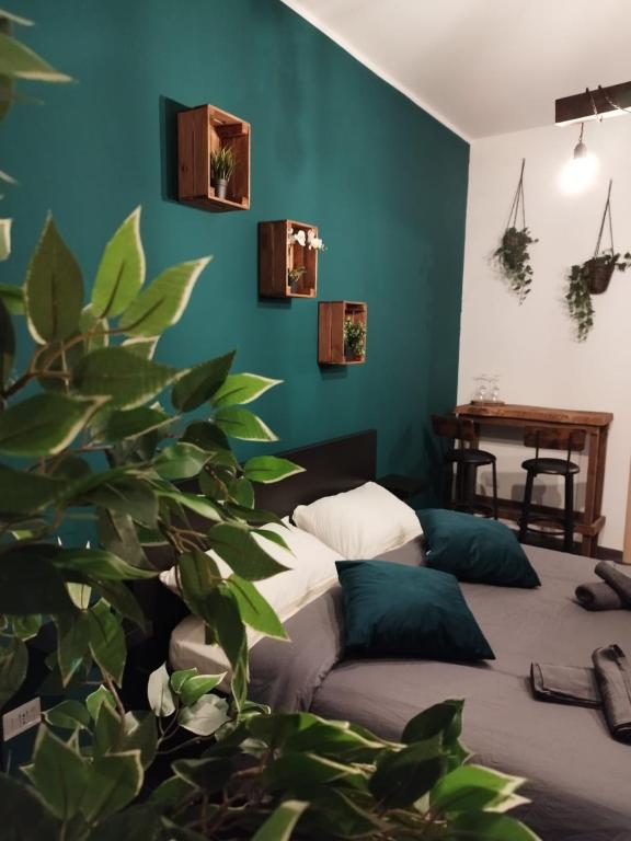 a bedroom with a bed and a green wall at Al Civico 15 Apartment in Salerno