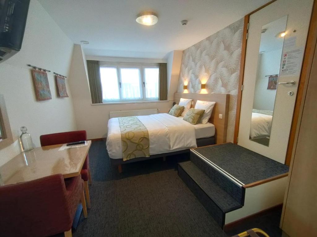 Postel nebo postele na pokoji v ubytování Hotel Fevery