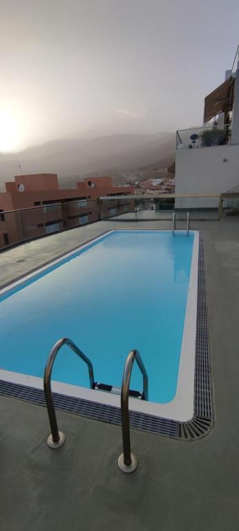 Bazén v ubytování TERRAZAS DE TABAIBA,PARKING AIR,WIFI VISTAs nebo v jeho okolí