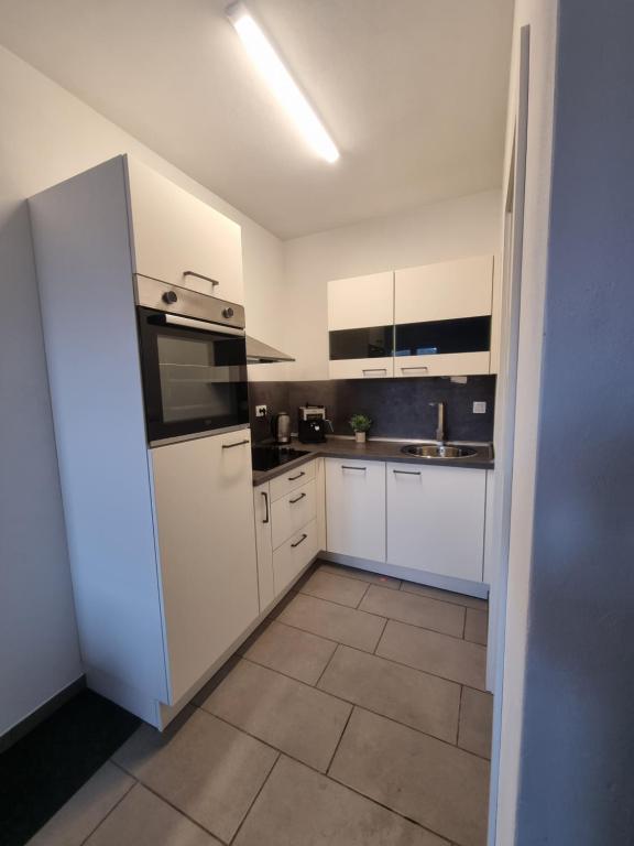 Kuchyň nebo kuchyňský kout v ubytování Apartments Žman