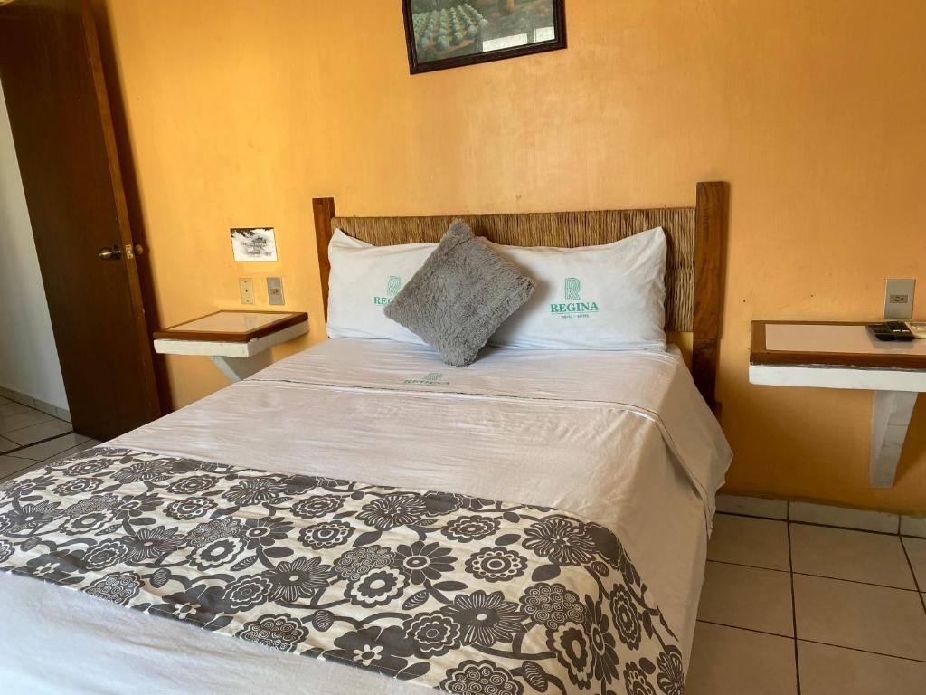 Postel nebo postele na pokoji v ubytování Hotel Suites Regina
